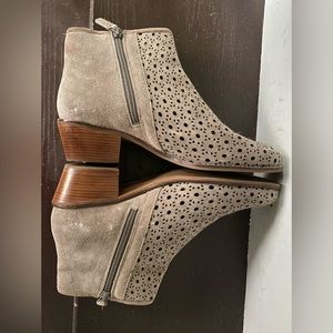 Dove gray heeled booties with daisy punched hole design